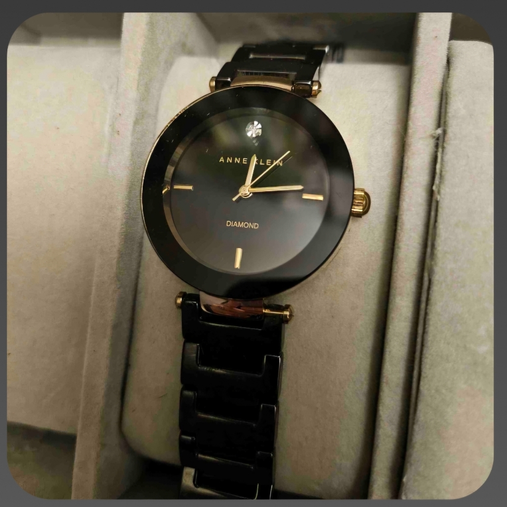 Anne Klein Black and gold watch